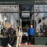 Glenn Malloy and Steve Davies with Juliet Downes outside the store in St Andrews