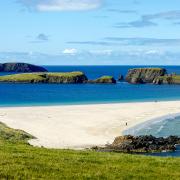 St Ninian's Isle, joined to mainland Shetland by a tombolo of sand at Bigton. Photograph: VisitScotland / Paul Tomkins